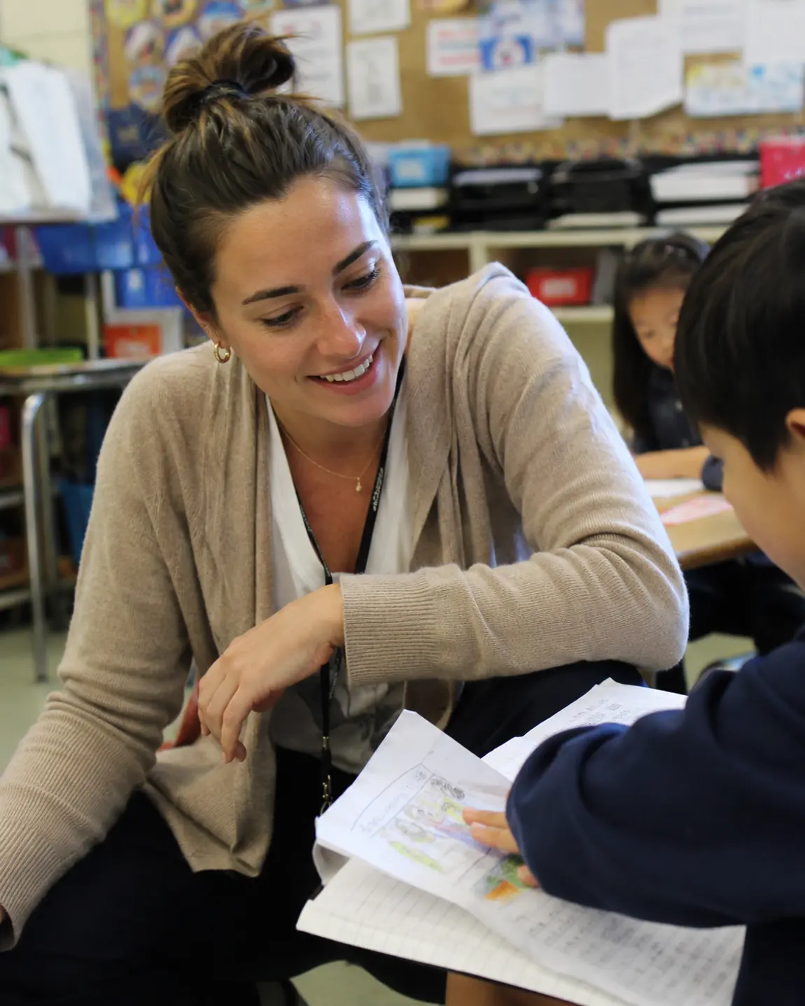 A teacher reading one-on-one with a student