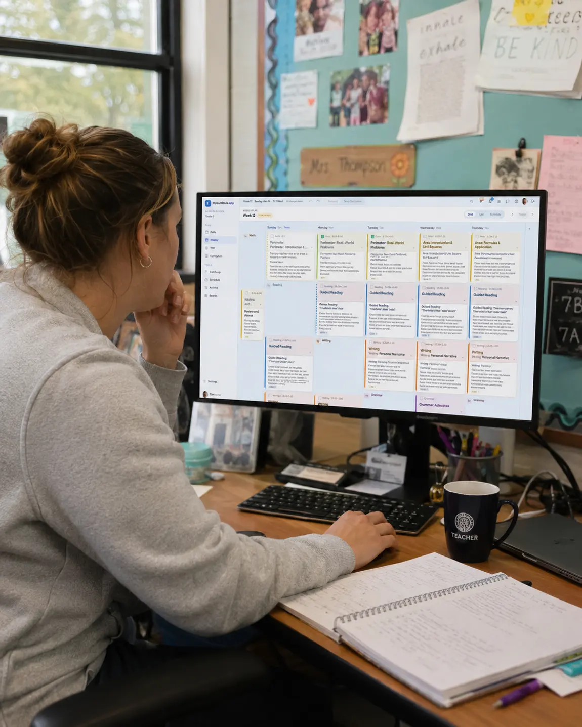A teacher reviewing the week's plan on screen